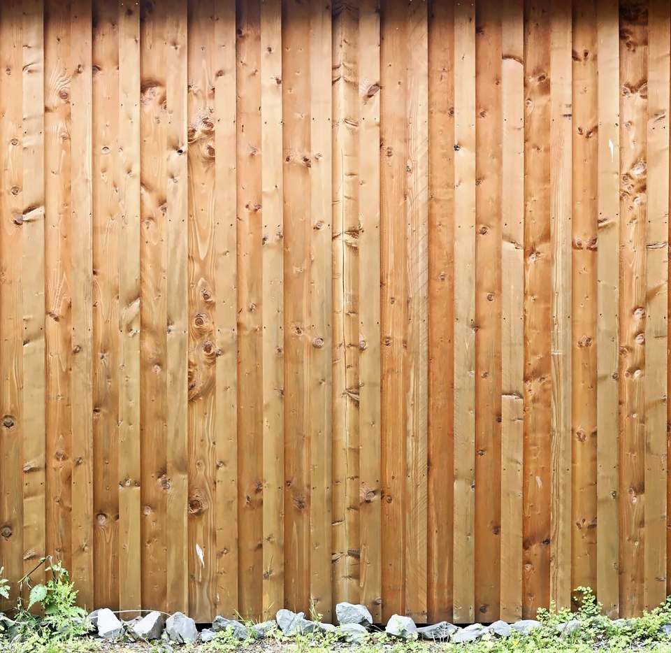 A run of closeboard timber fencing over a gravel board